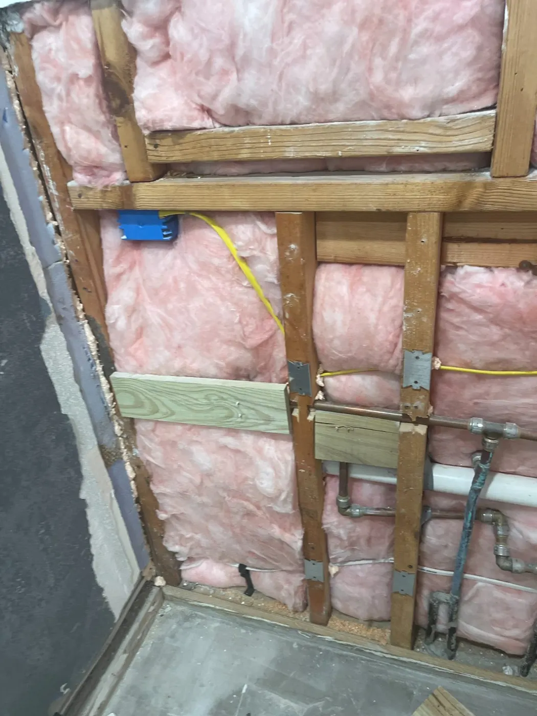 Plumbing wall opened by a flood cut for drying and inspection